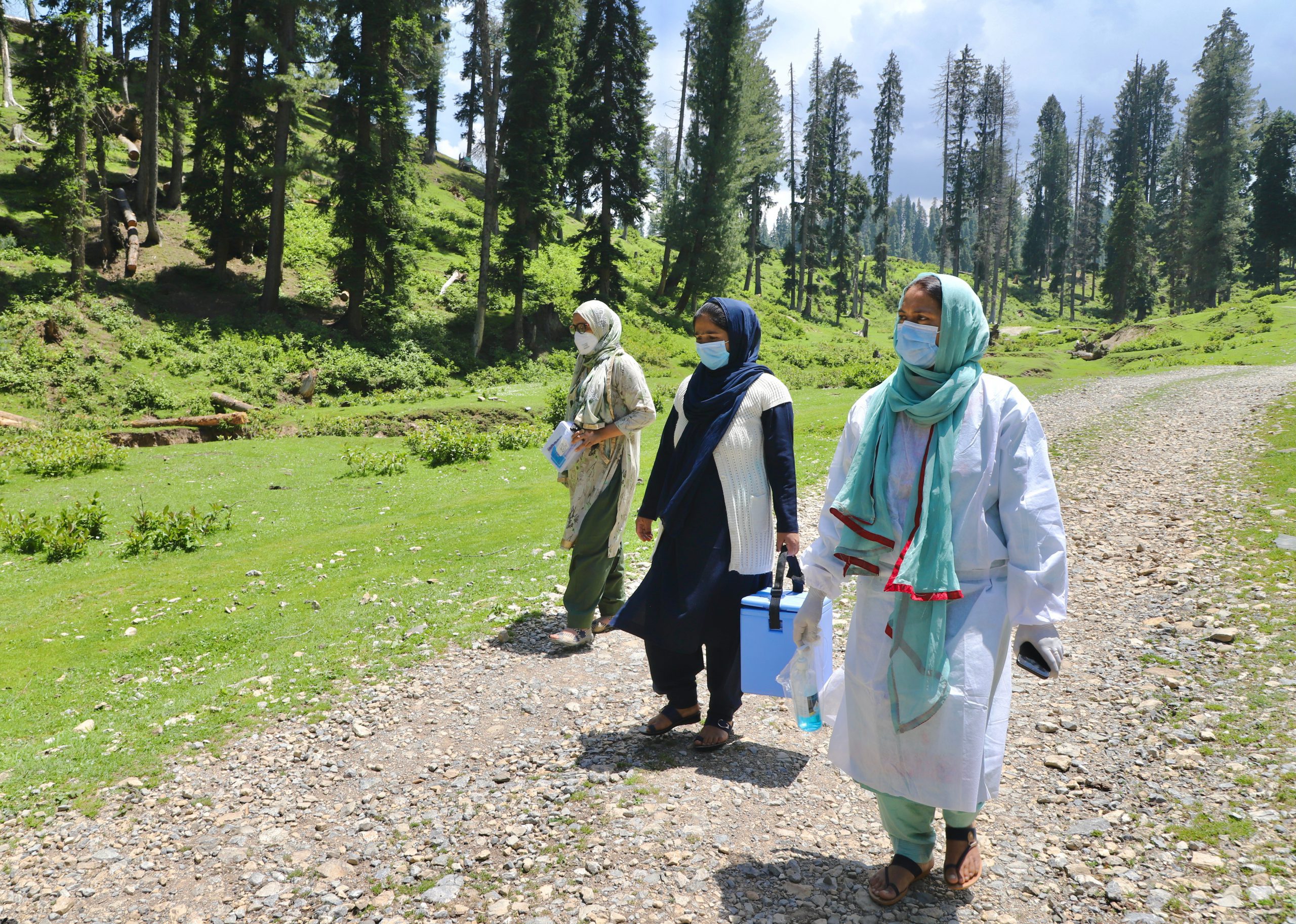 Masooda Akhter and her ASHA colleagues on a vaccine drive in Yusmarg. Photo Credit/ Faisal Bashir