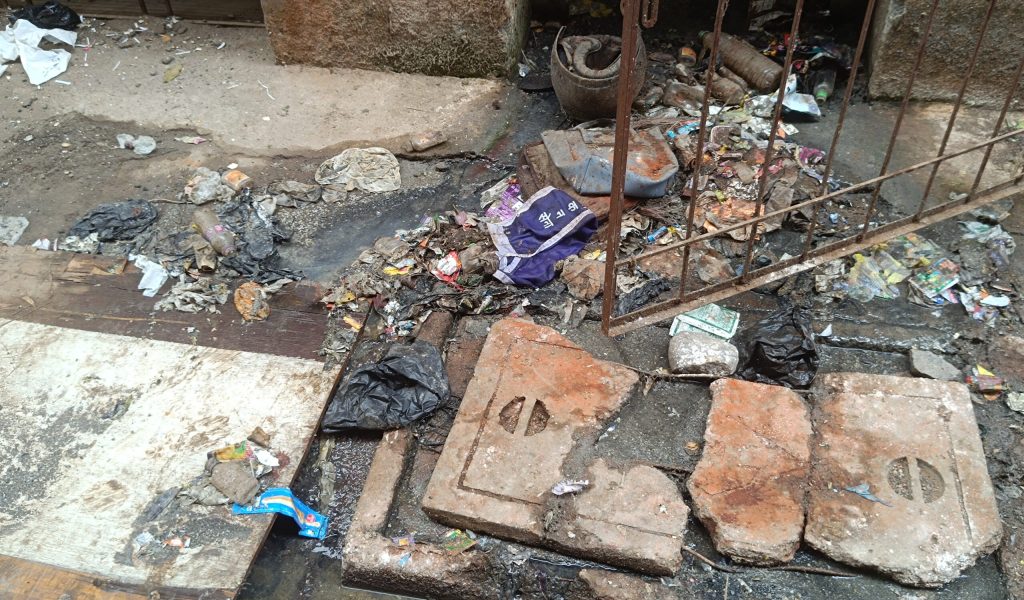 Photo 10 - The trash and sewage just outside the Health Post